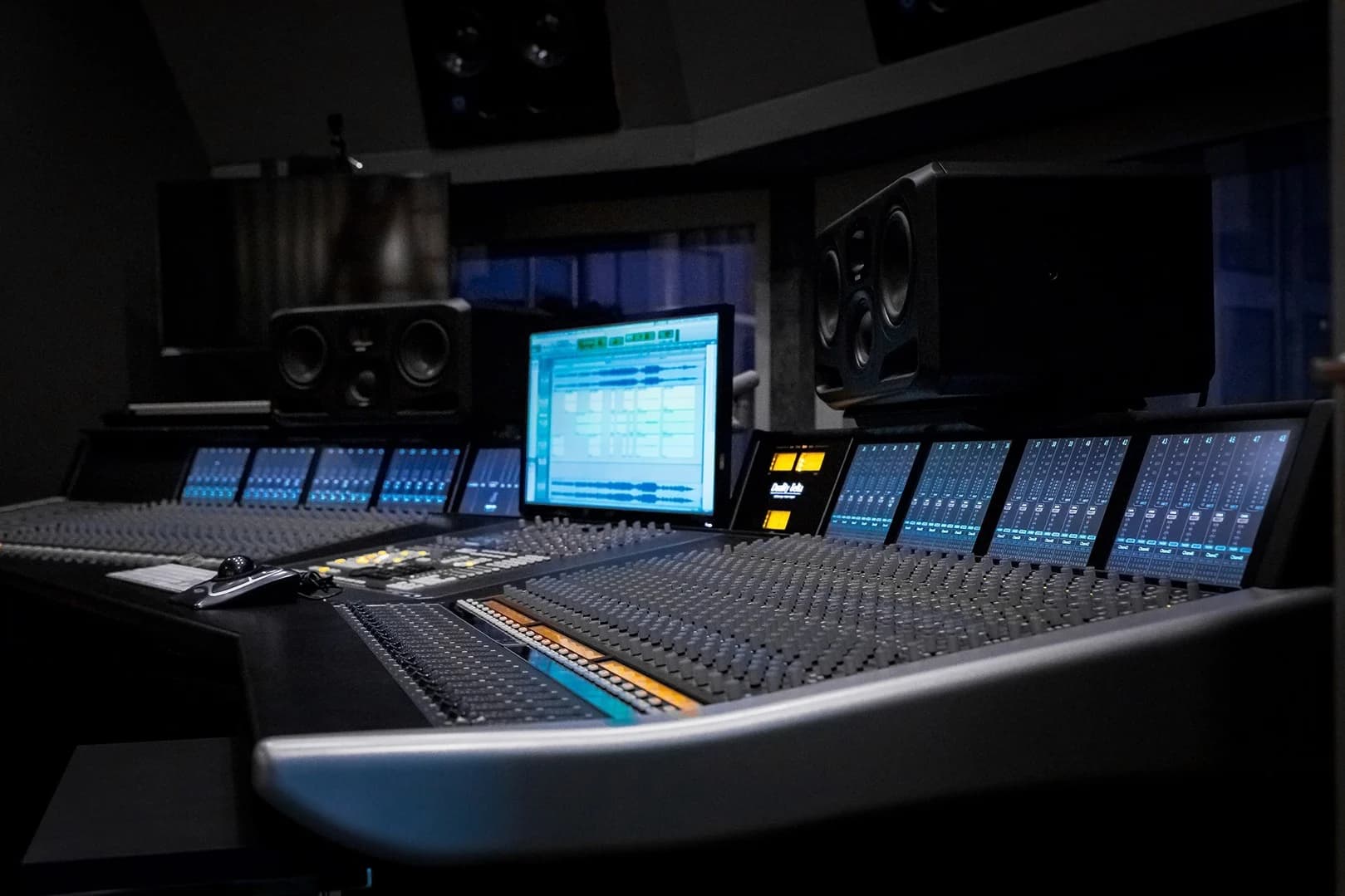 Modern Recording Studio Control Room with Purple Lighting